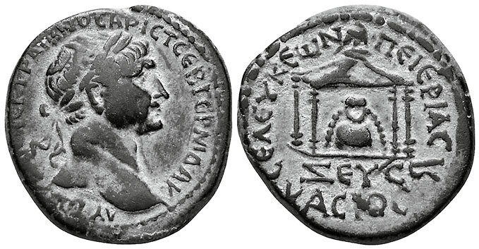 Coinage under Trajan, Seleucia Pieria, 114–116 CE, (BMC 41), Æ 26 mm, 11,1 g. Image obverse laureate head right. Image reverse: cult stone (baitylos) of Zeus Kasios within tetrastyle shrine surmounted by eagle, beneath ZEYC KACIOC