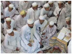 Figure 13.12: Recitation from the handwritten awrāq during the ʿurs of several Dāʿīs at the Qabaristān (graveyard) (above), and during the oration of the story of Karbala during Muḥarram in the mosque (below), both in Baroda