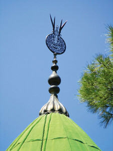 Metal finial (Ê¿alam) showing the name of Ali written in mirror script and the bifurcated blades of his sword Dhuâl-Fiqar, atop the dome of the shrine of Abdal Musa