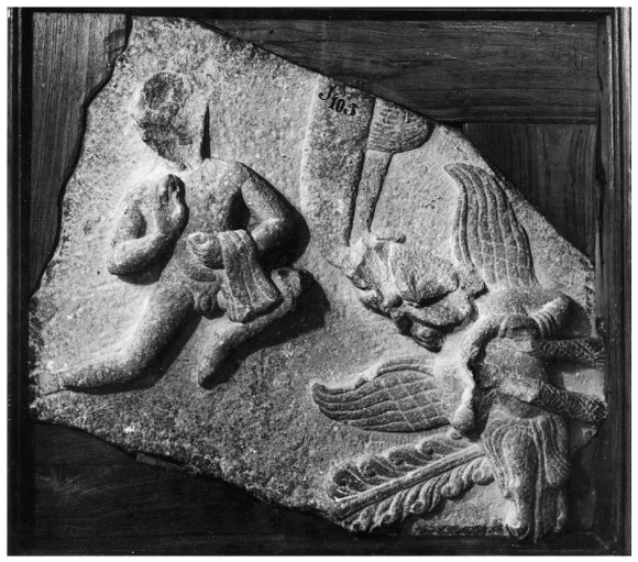 A fragment depicting a naked flying figure who holds a cloth in his left hand and a human/bird figure. A part of the umbrella is also depicted on the top of the fragment.
