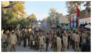 The author participates in an Ashura morning procession in Khorramabad, 2015, his body covered in mud, following the local ritual practice of mourning.