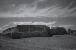 The landscape of the mind…’ is a black and white photograph by Paul Kohl which shows horsehair clouds over the Venetian walls of Famagusta. The Cathedral of St. Nicholas / Lala Mustapha Pasha Mosque is in the background on the extreme left of the picture.